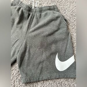 Grey Nike men shorts sz XL. Has a few bleach spot shown in pics and grease spot